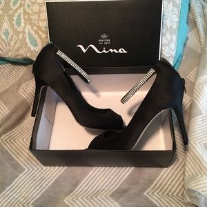 Black satin “Nina” dress shoes.